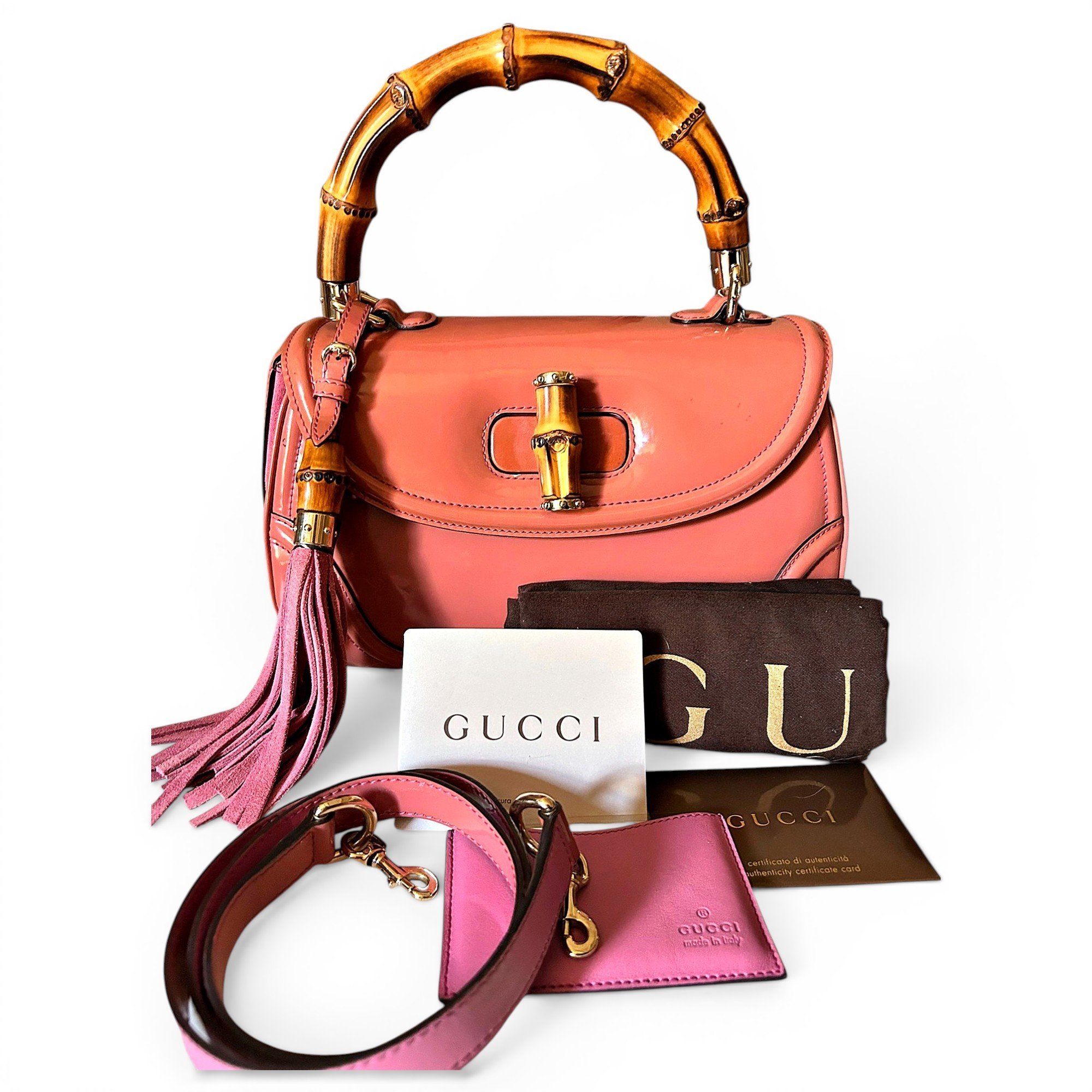 Gucci Convertible Pompon Bamboo Top Handle patent leather handbag