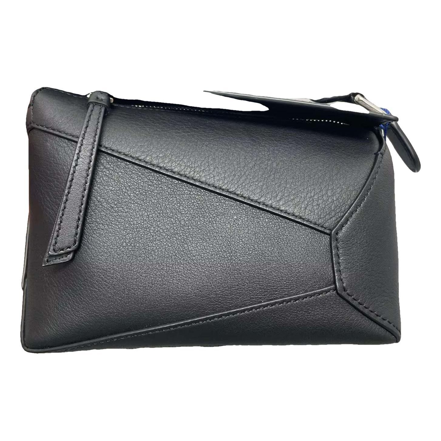 Puzzle leather handbag
