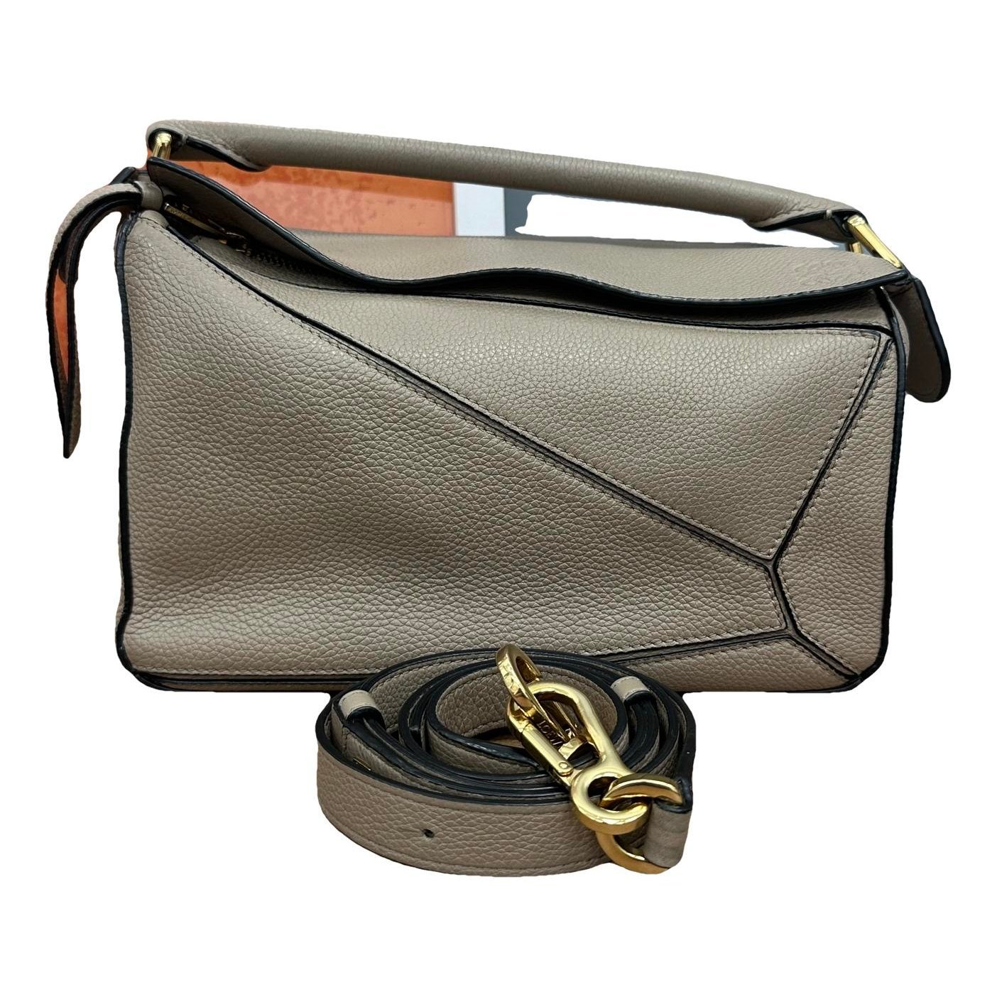 Puzzle leather handbag