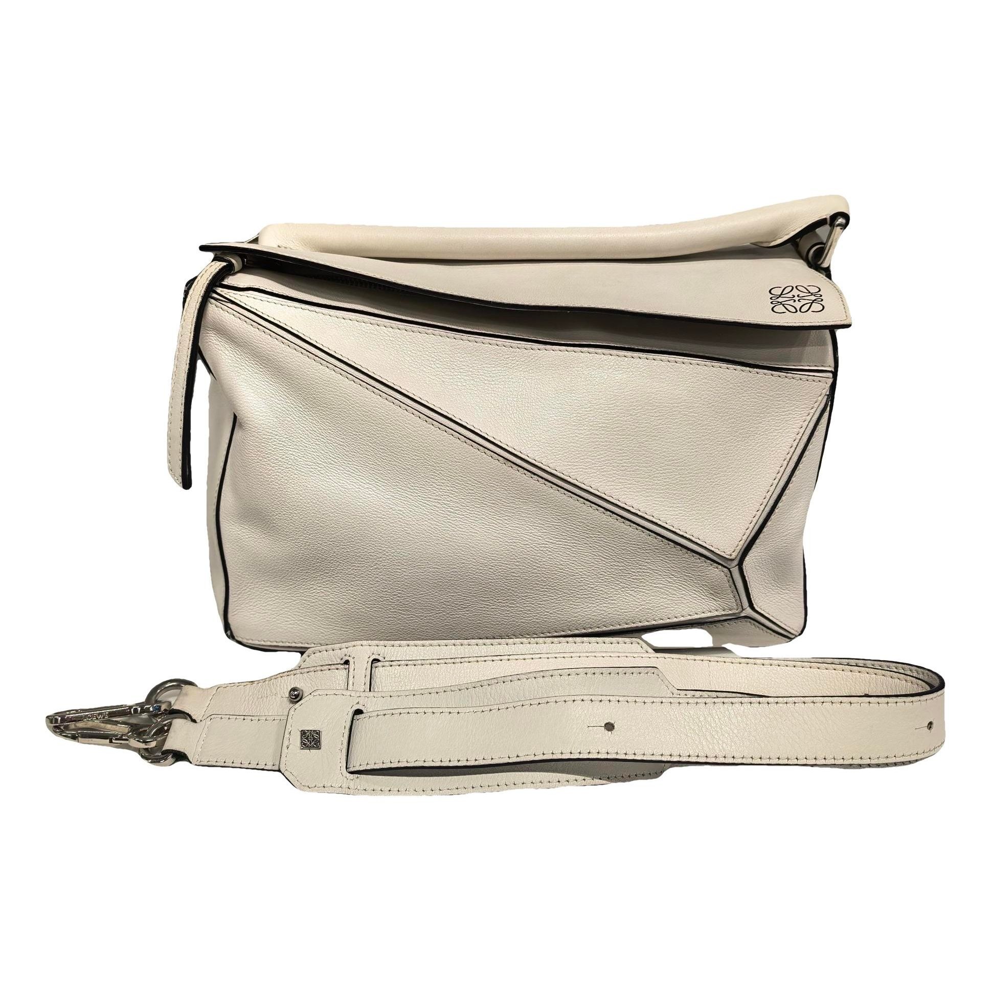 Puzzle leather handbag