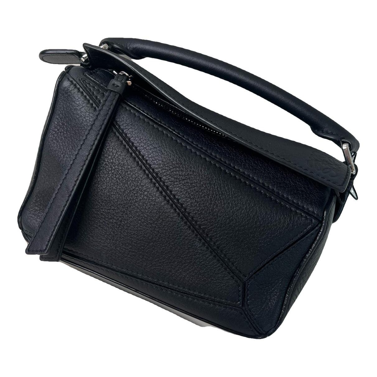 Puzzle leather handbag