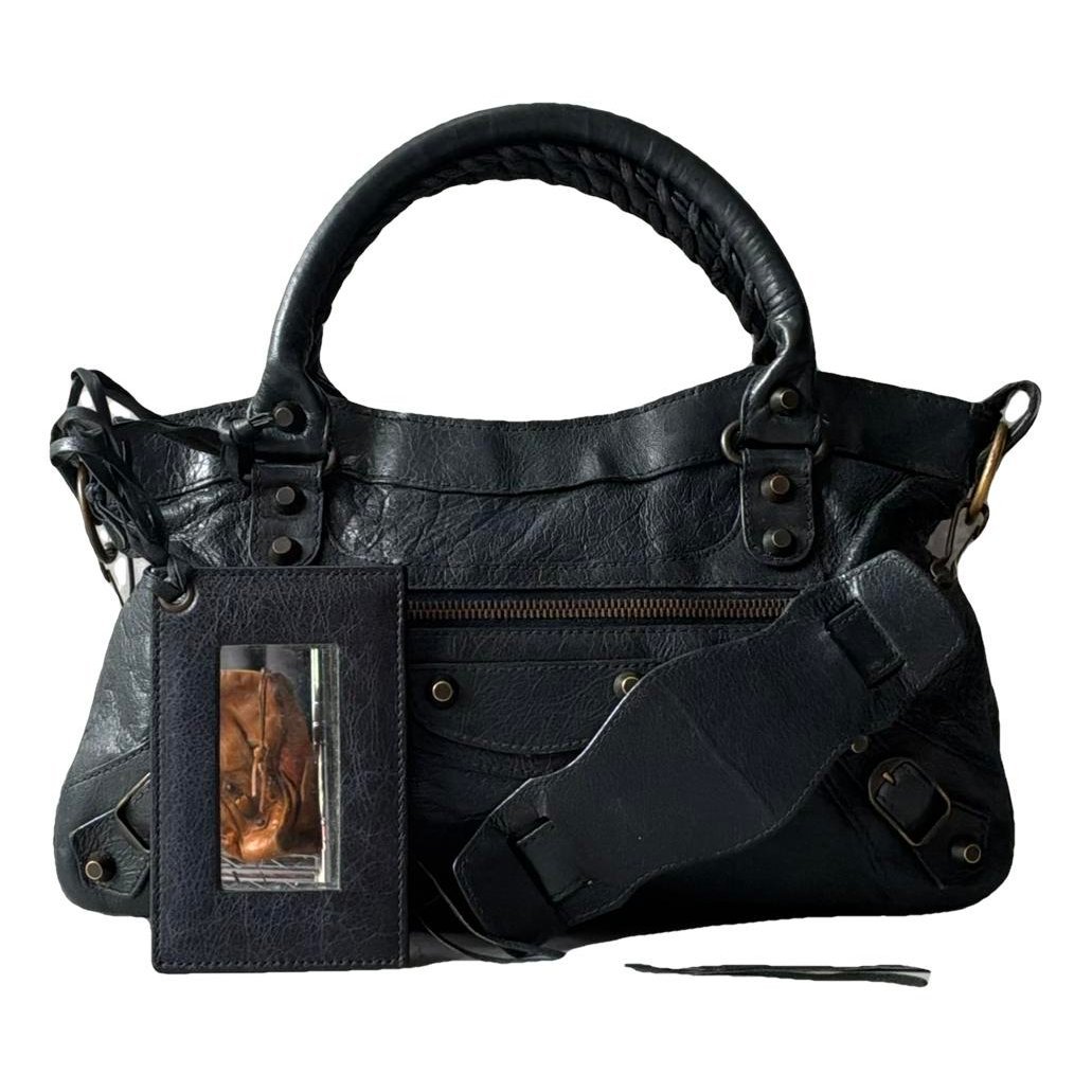 First leather handbag
