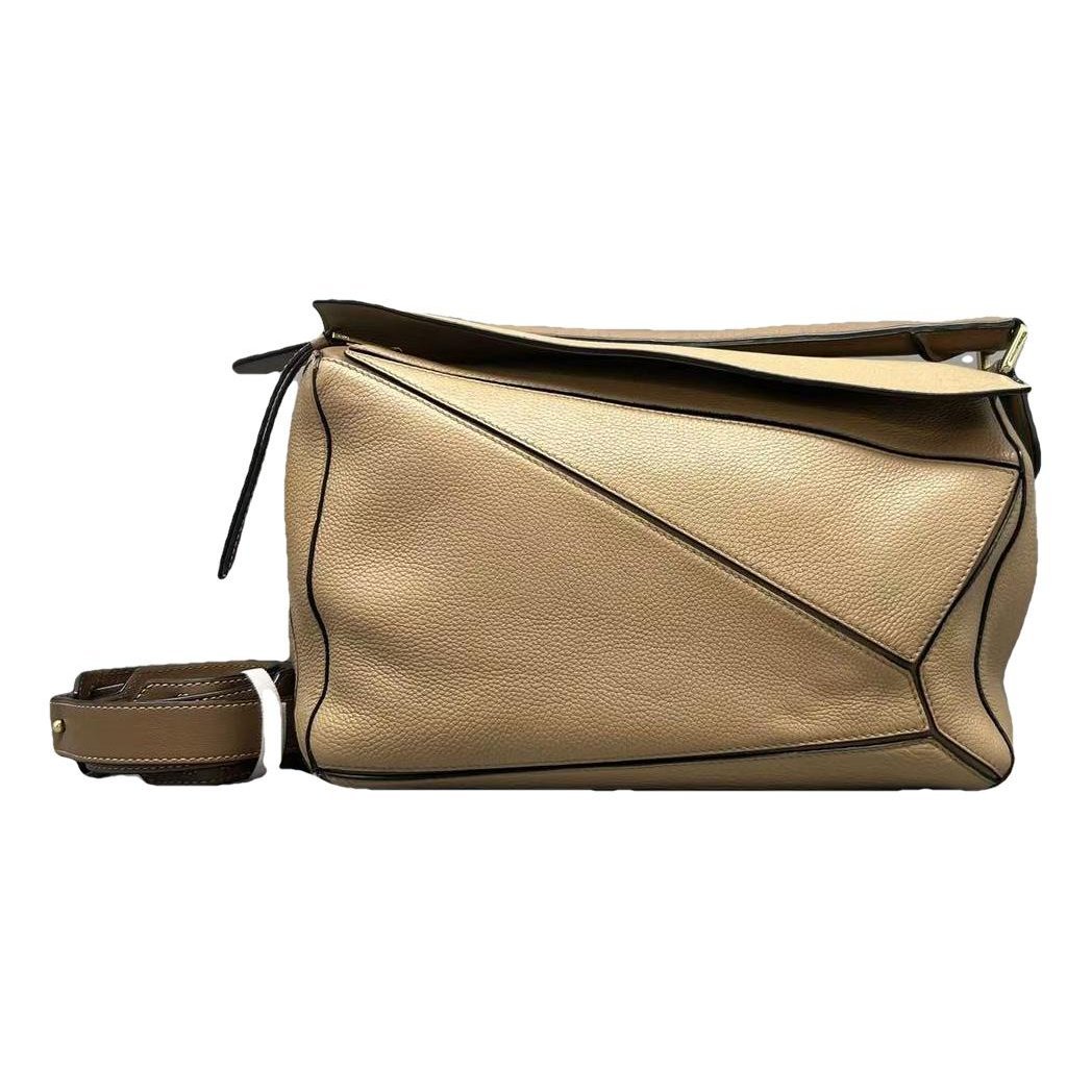 Puzzle leather handbag