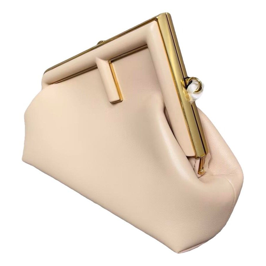 First leather handbag