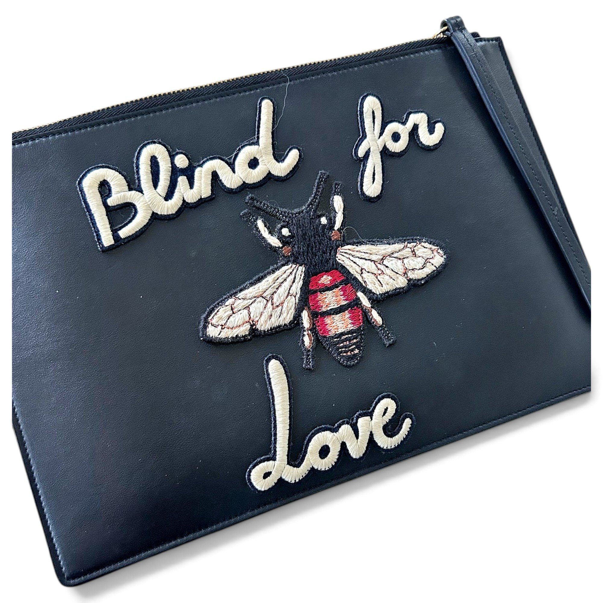 Animalier leather clutch bag