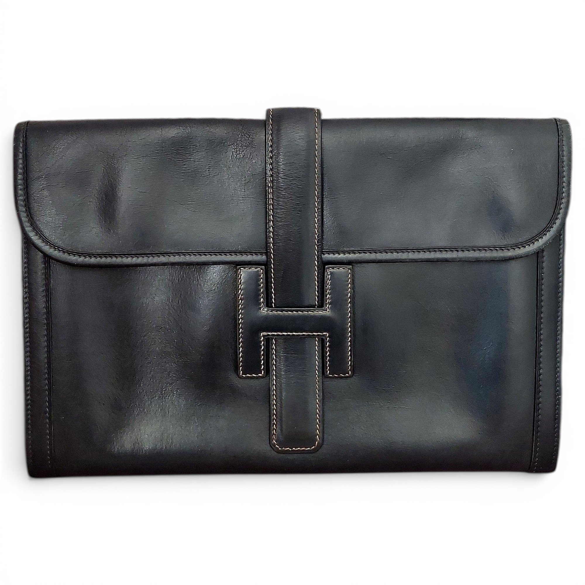 Jige leather clutch bag