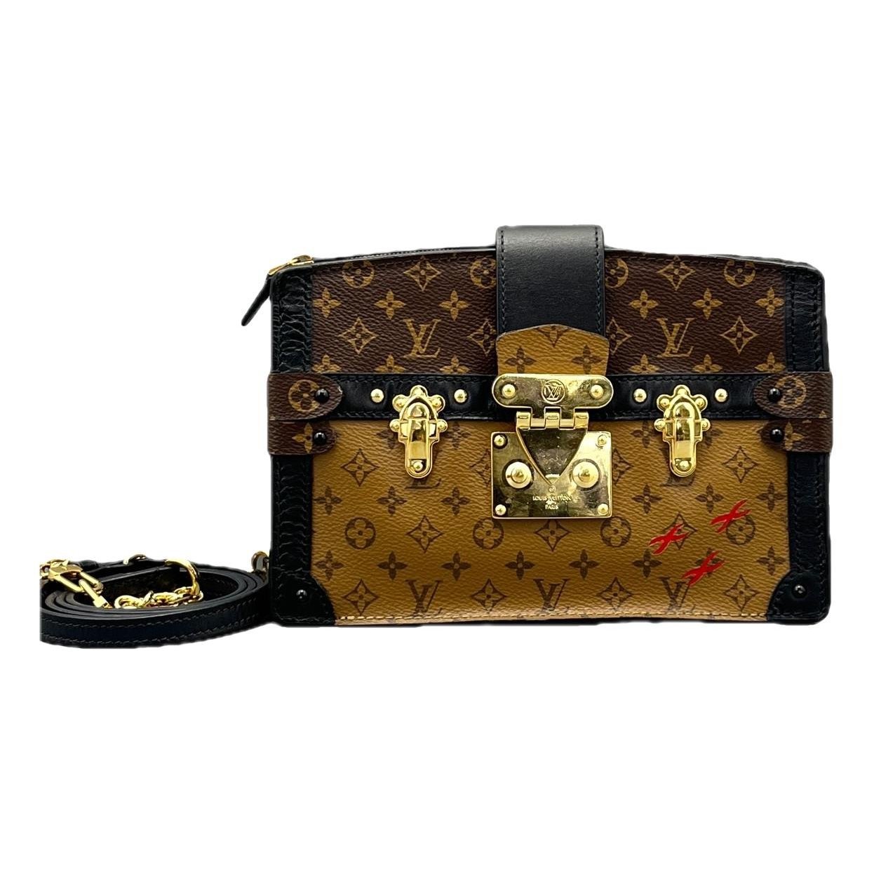 Pochette Trunk leather handbag