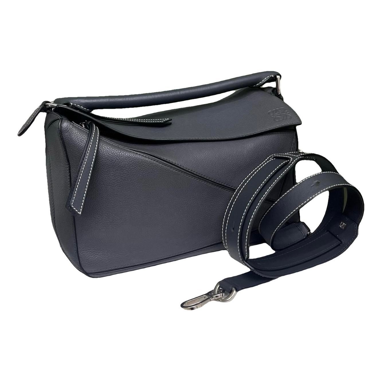 Puzzle leather handbag
