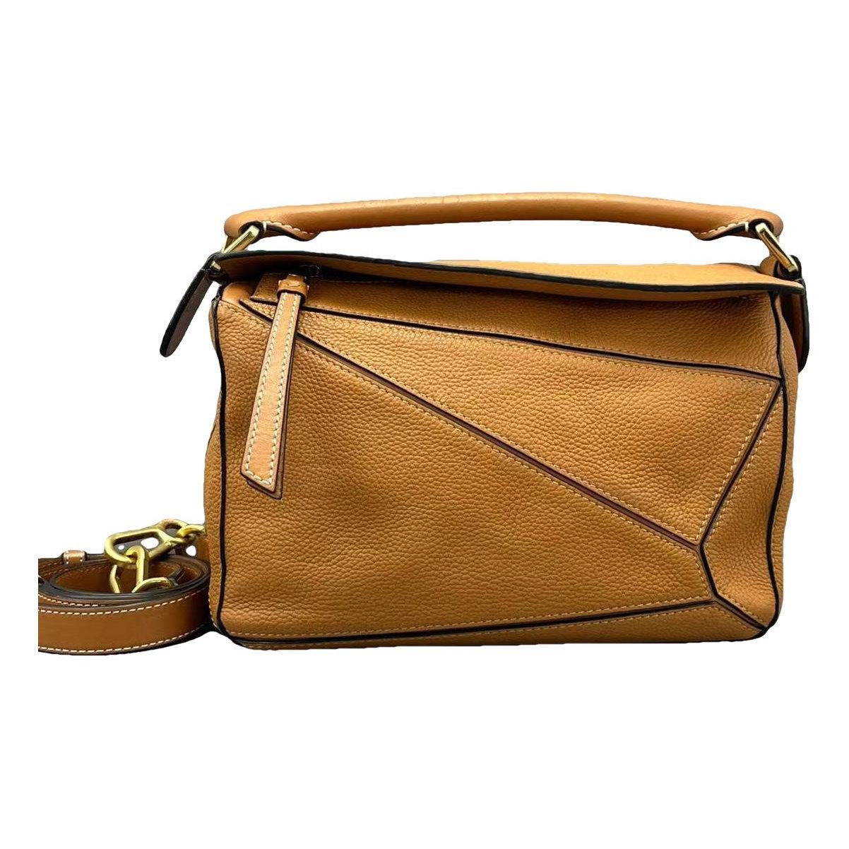 Puzzle leather handbag