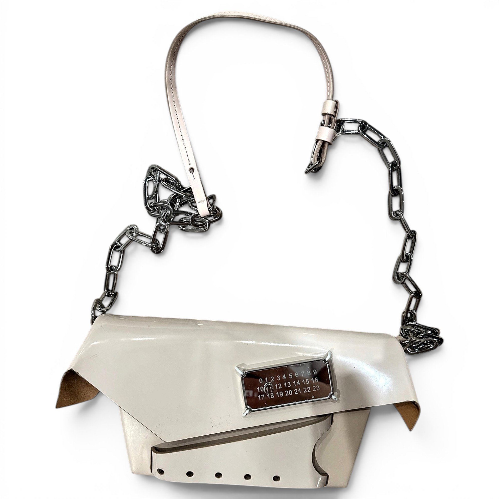 Snatched patent leather handbag
