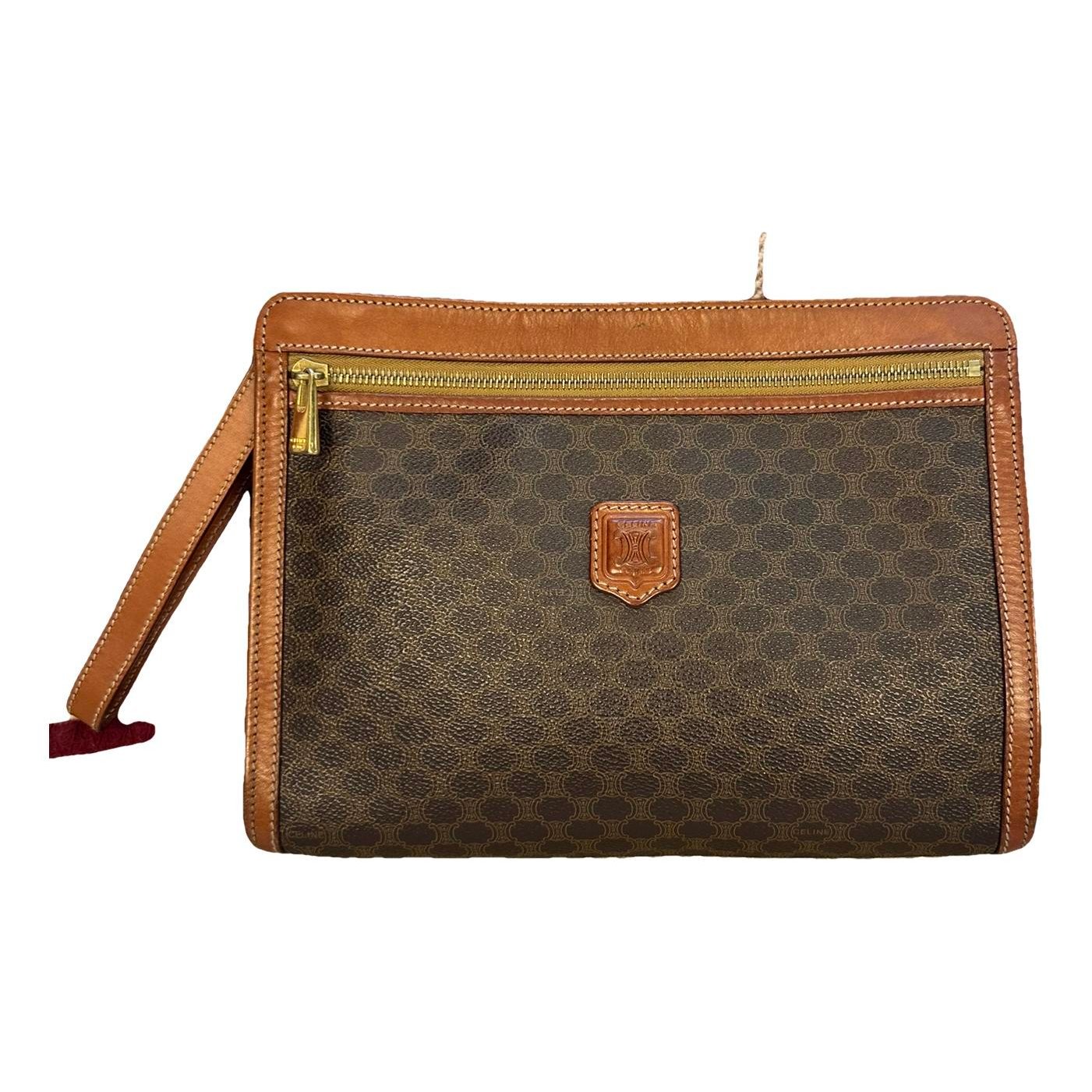 Triomphe Vintage leather clutch bag