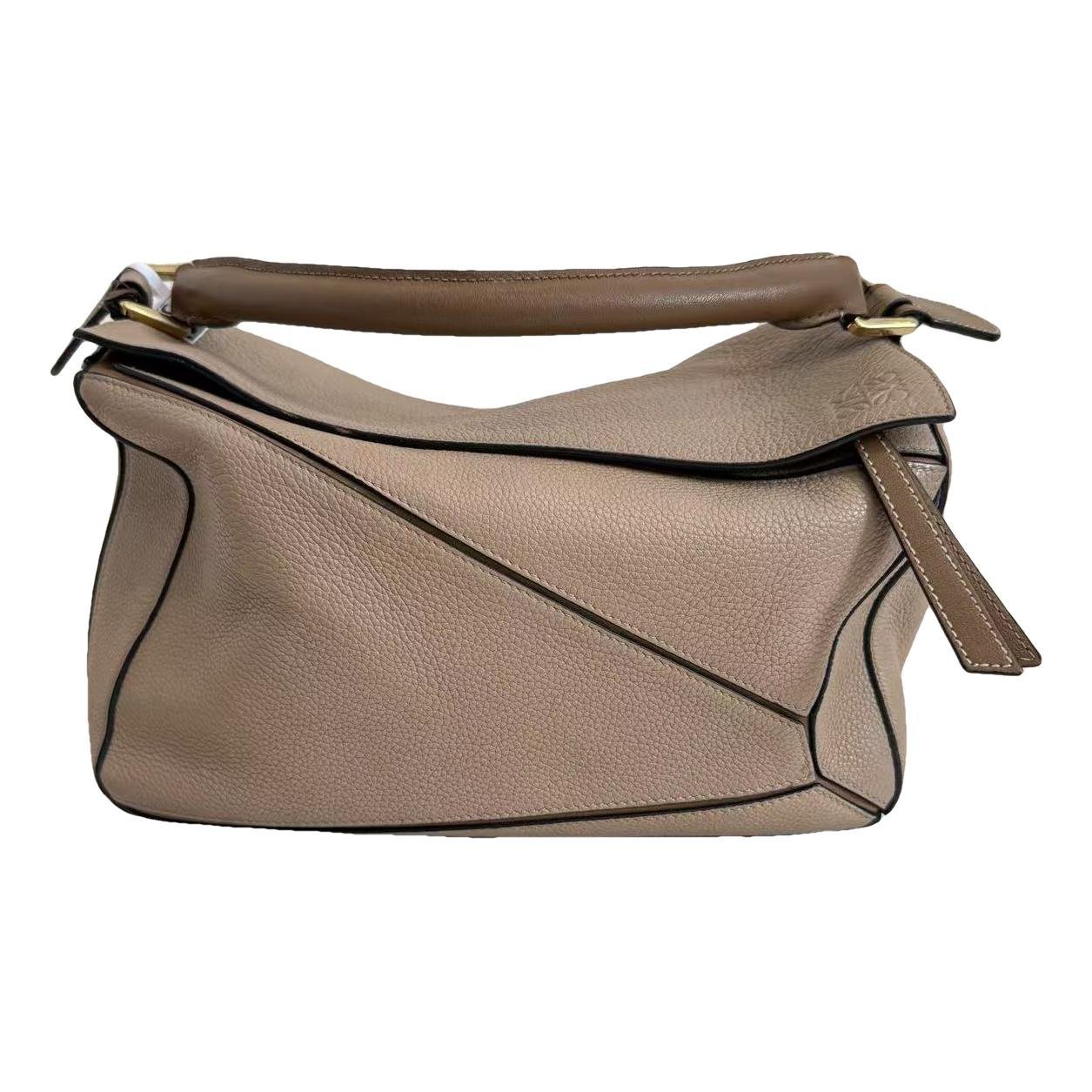Puzzle leather handbag