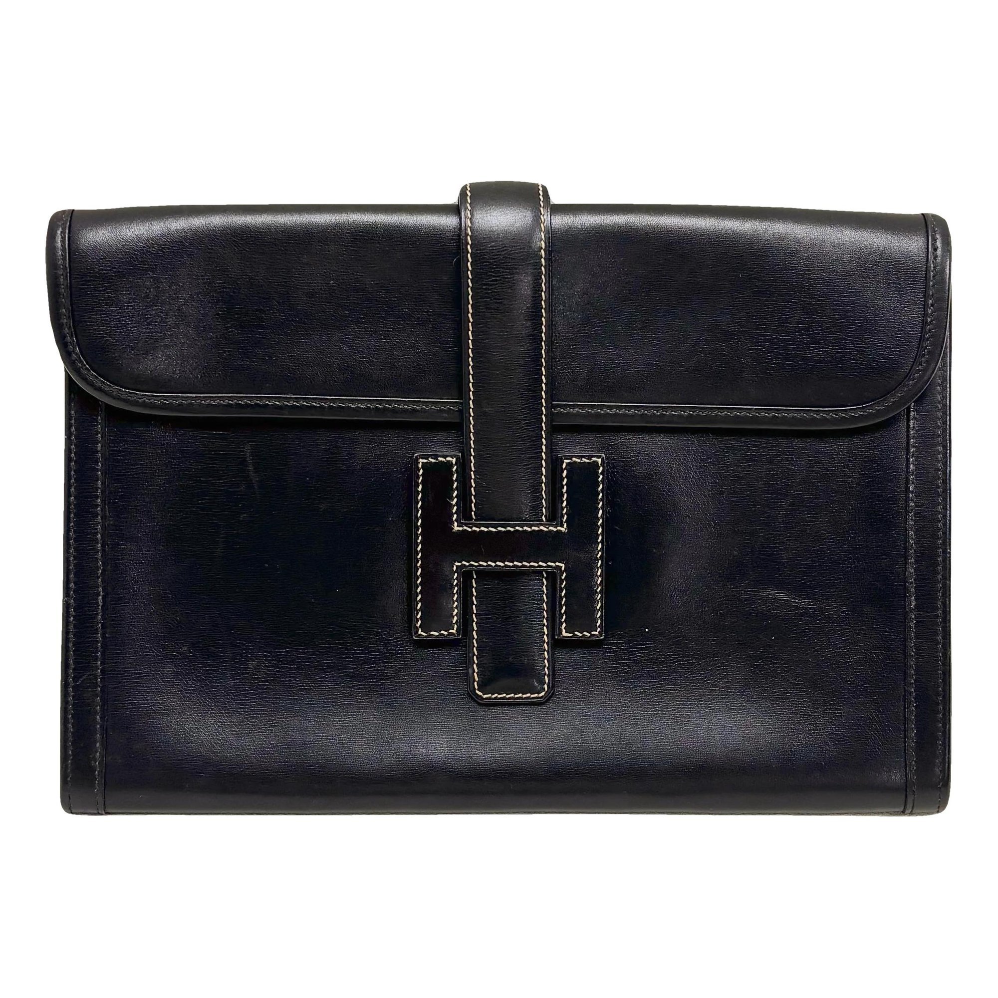 Jige leather clutch bag