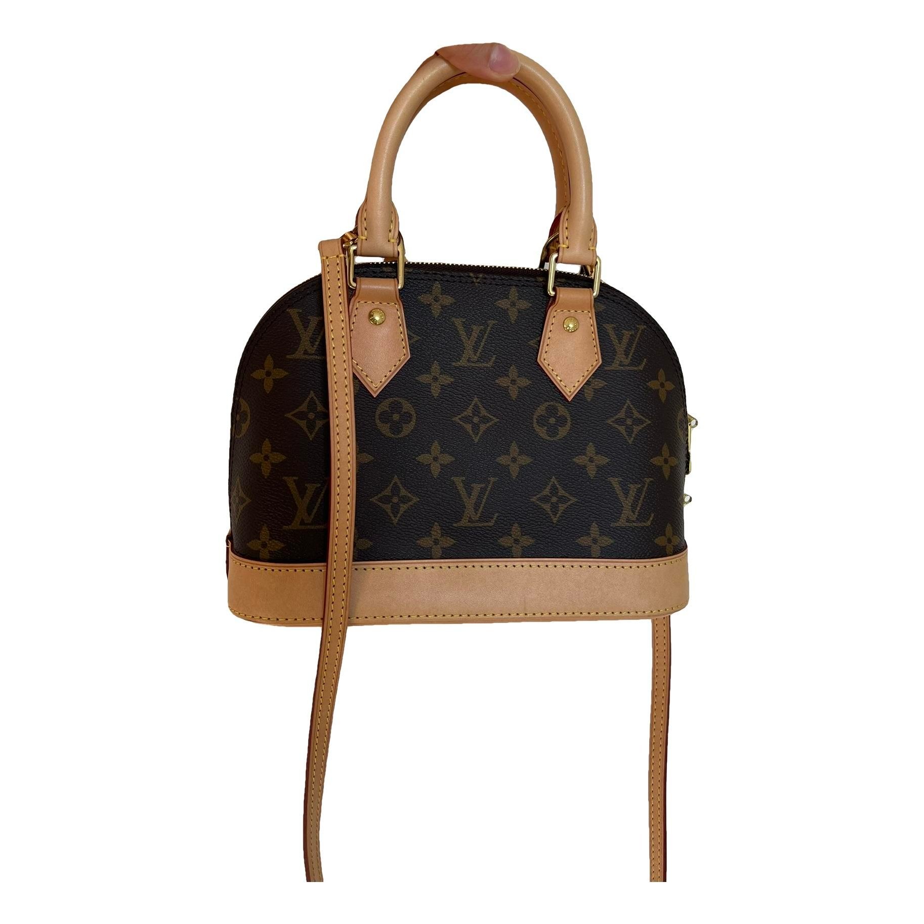Louis Vuitton Alma BB cloth handbag