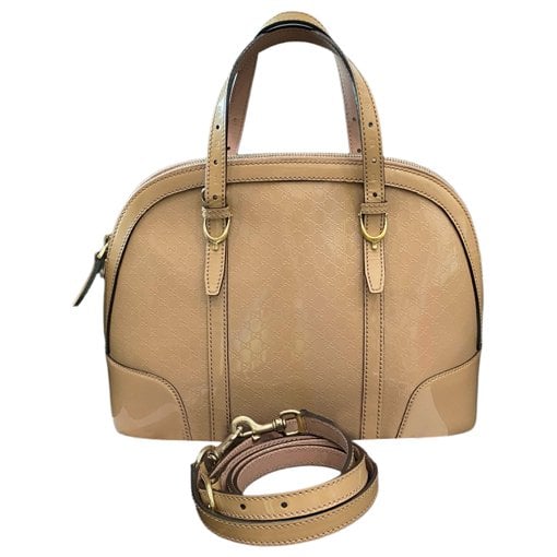 Dôme patent leather handbag