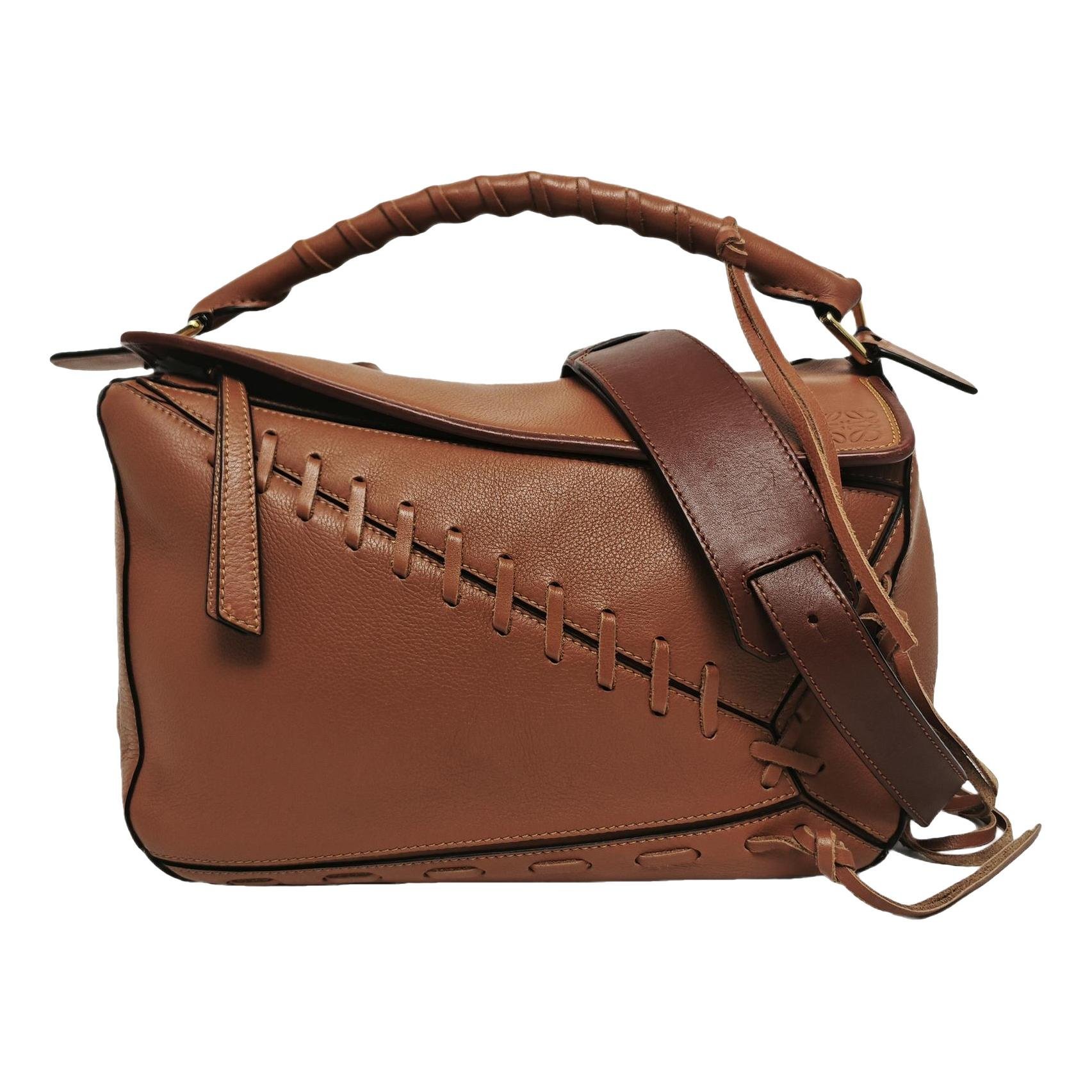Puzzle leather crossbody bag