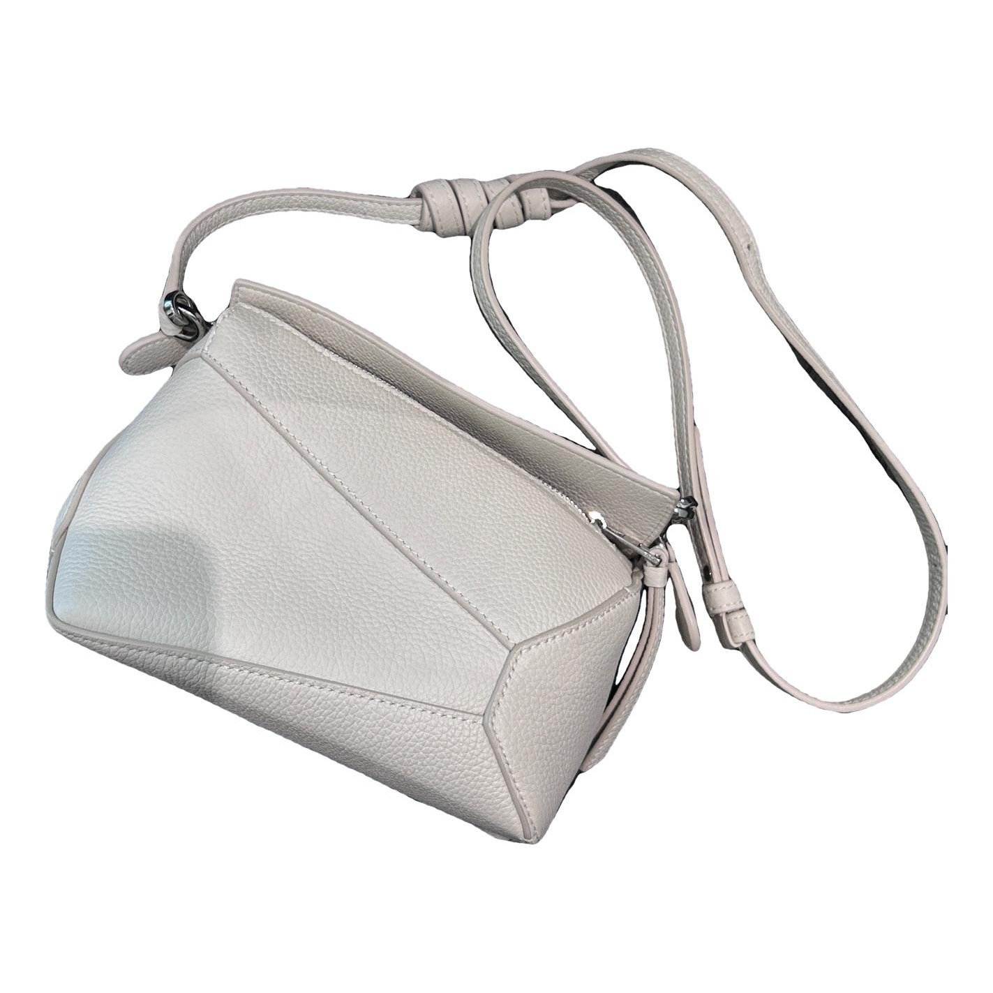Puzzle leather handbag