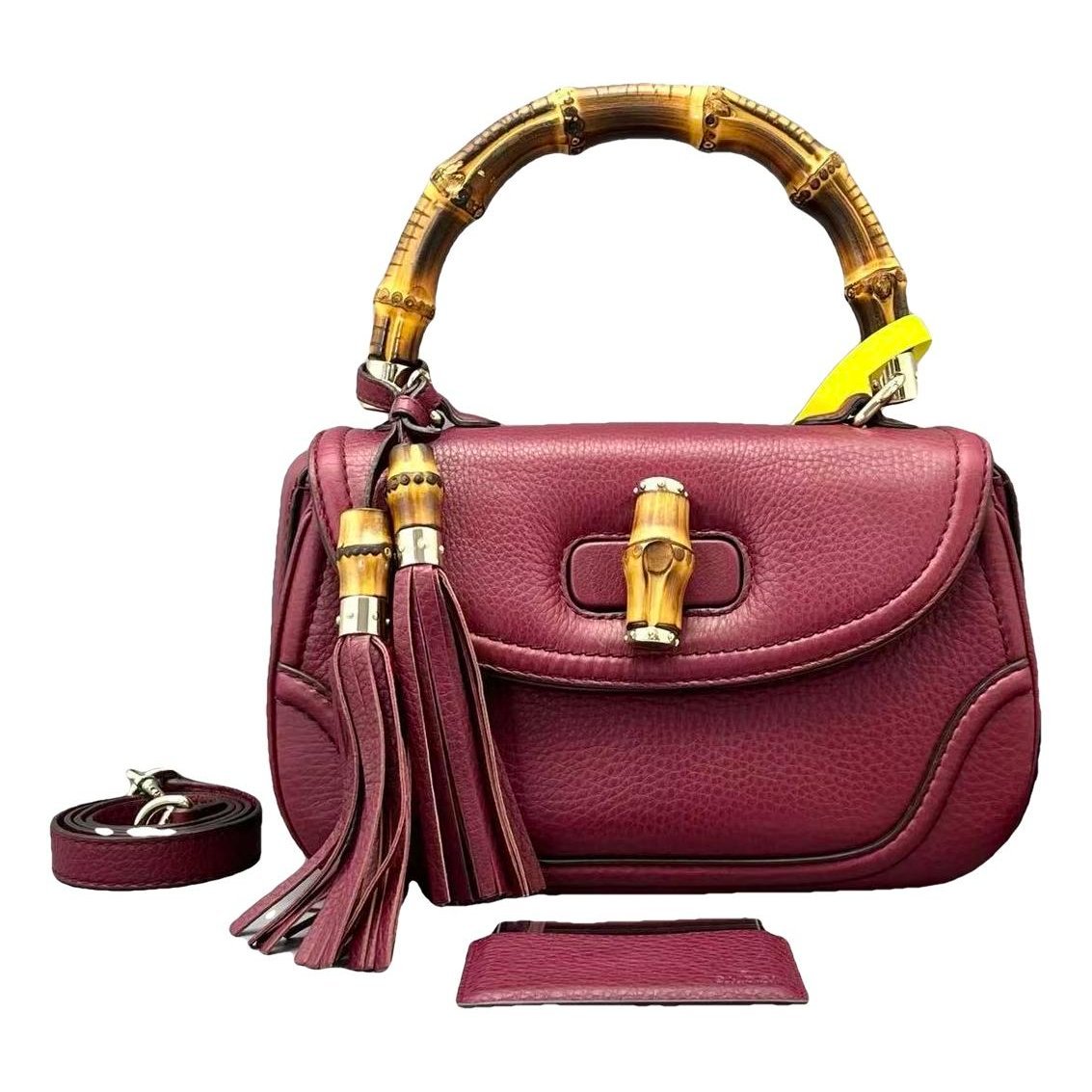 Convertible Pompon Bamboo Top Handle leather handbag