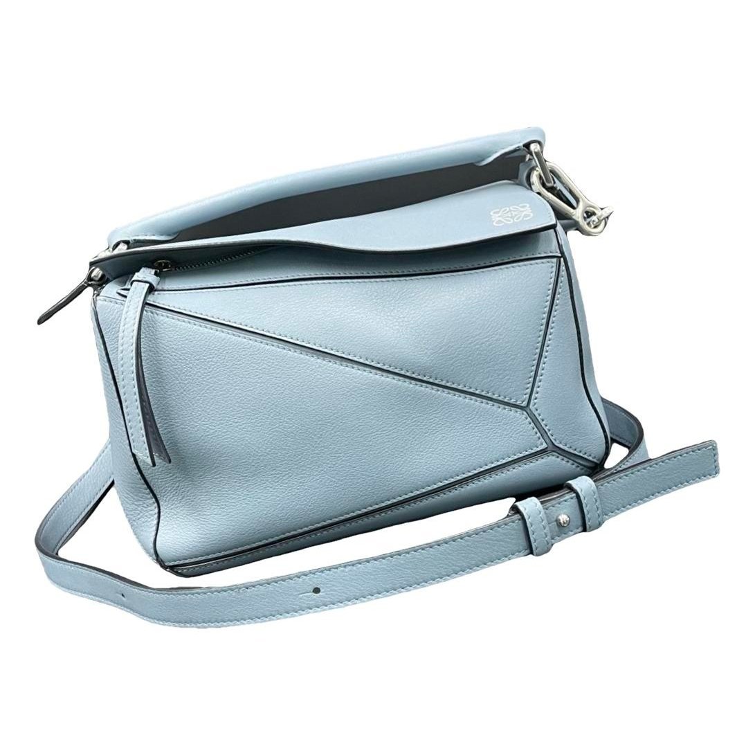 Puzzle leather handbag