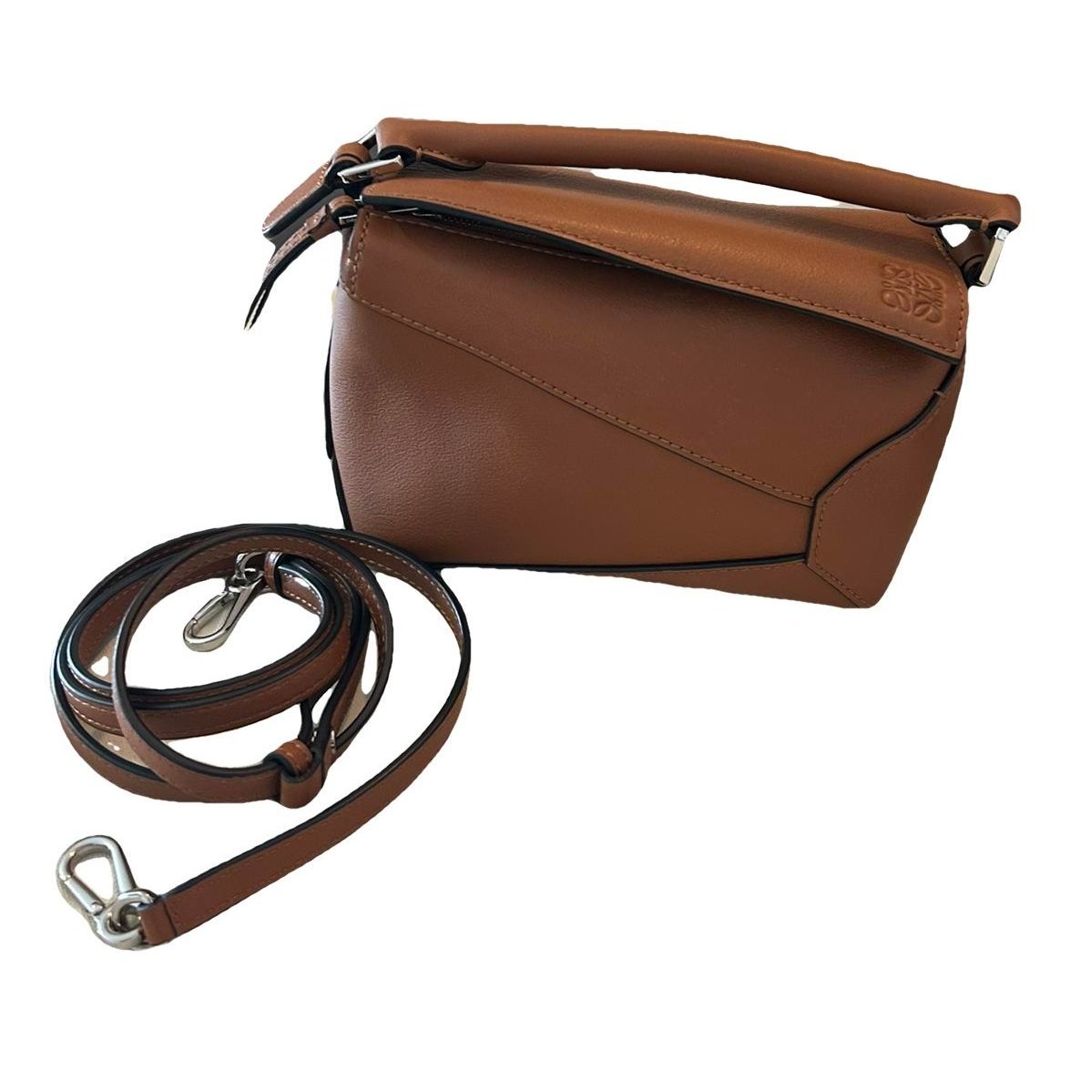 Puzzle leather clutch bag