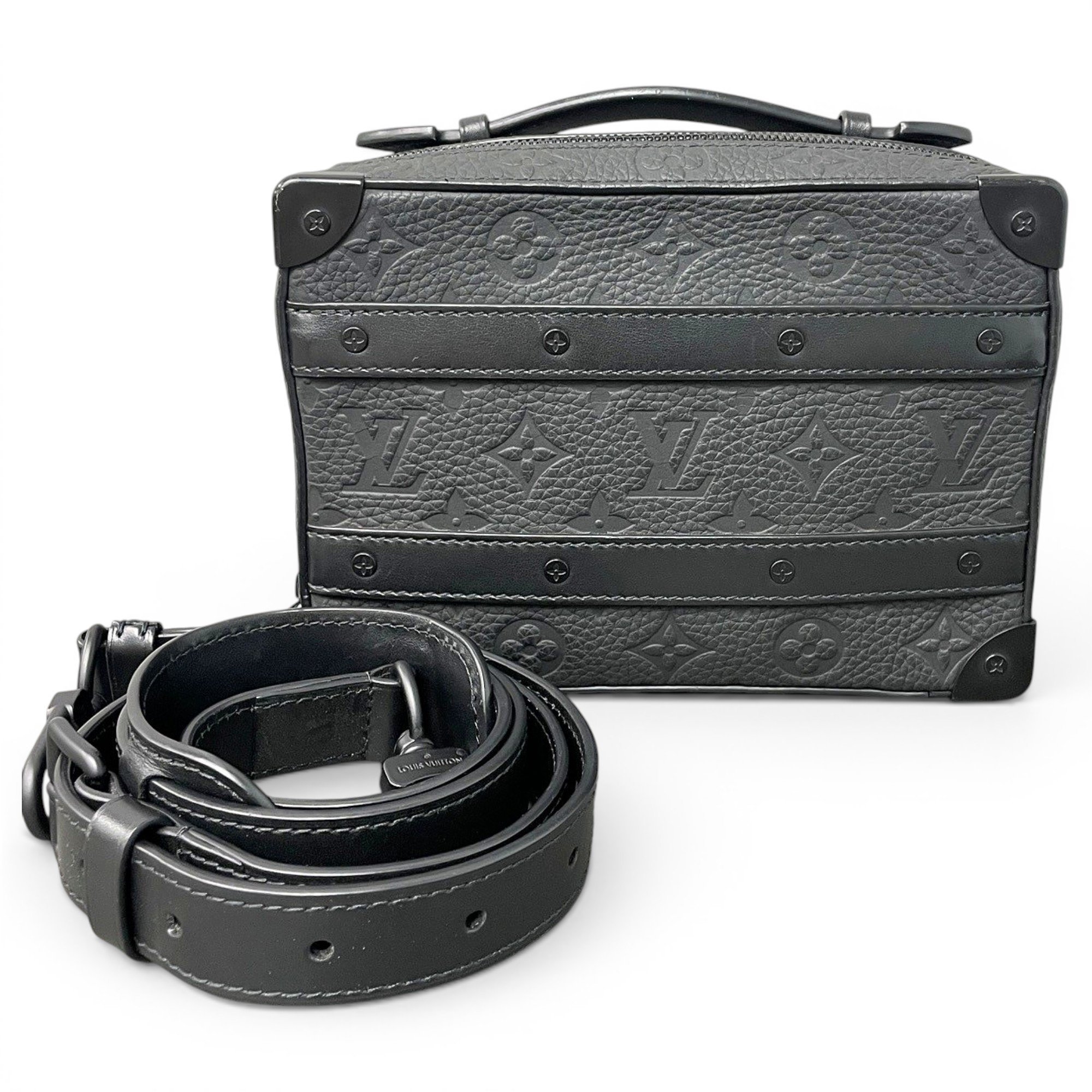 Pochette Trunk leather handbag