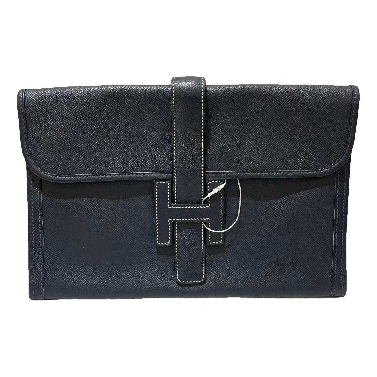 Jige leather clutch bag