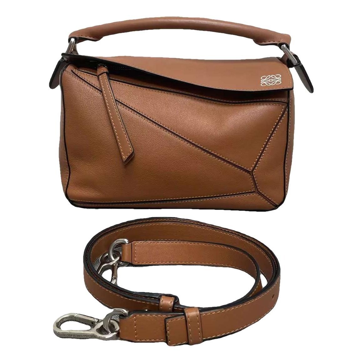 Puzzle leather handbag