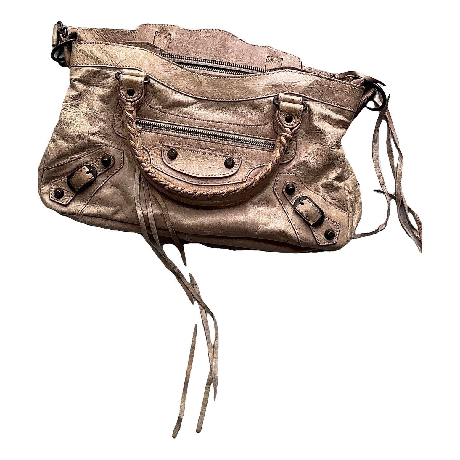 First leather handbag