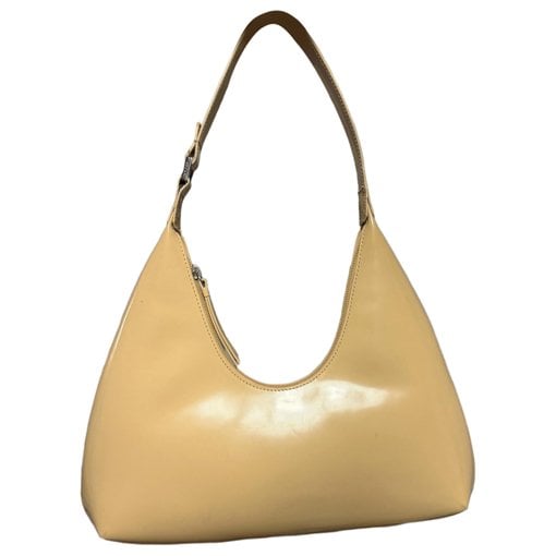 Amber patent leather handbag