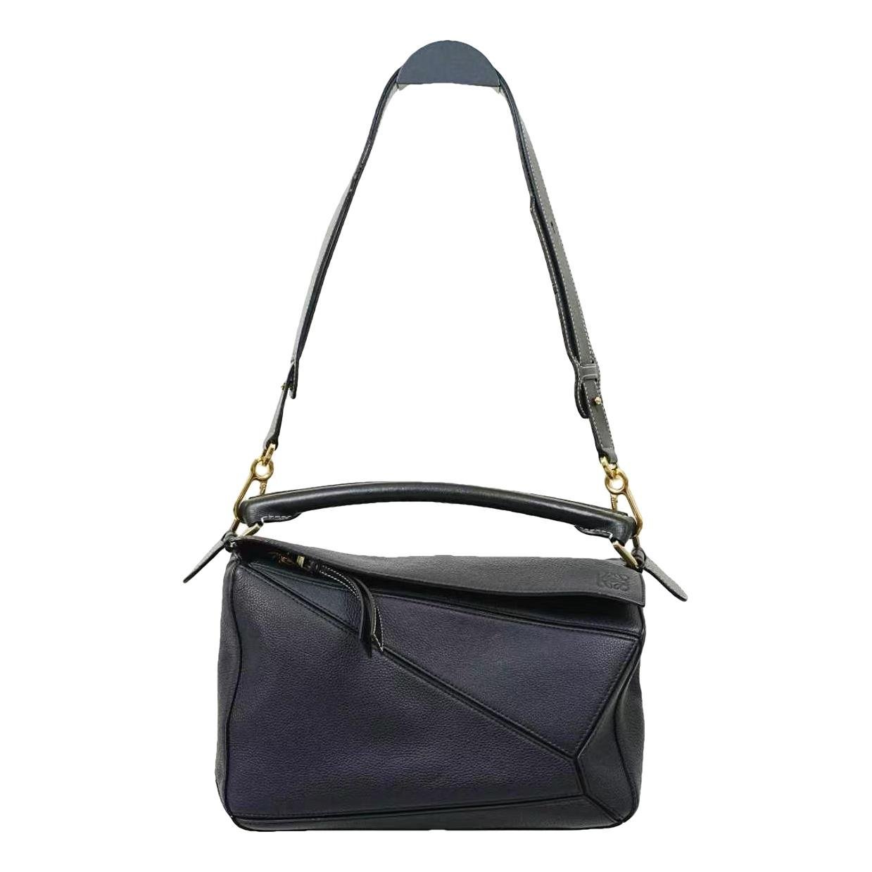 Puzzle leather handbag