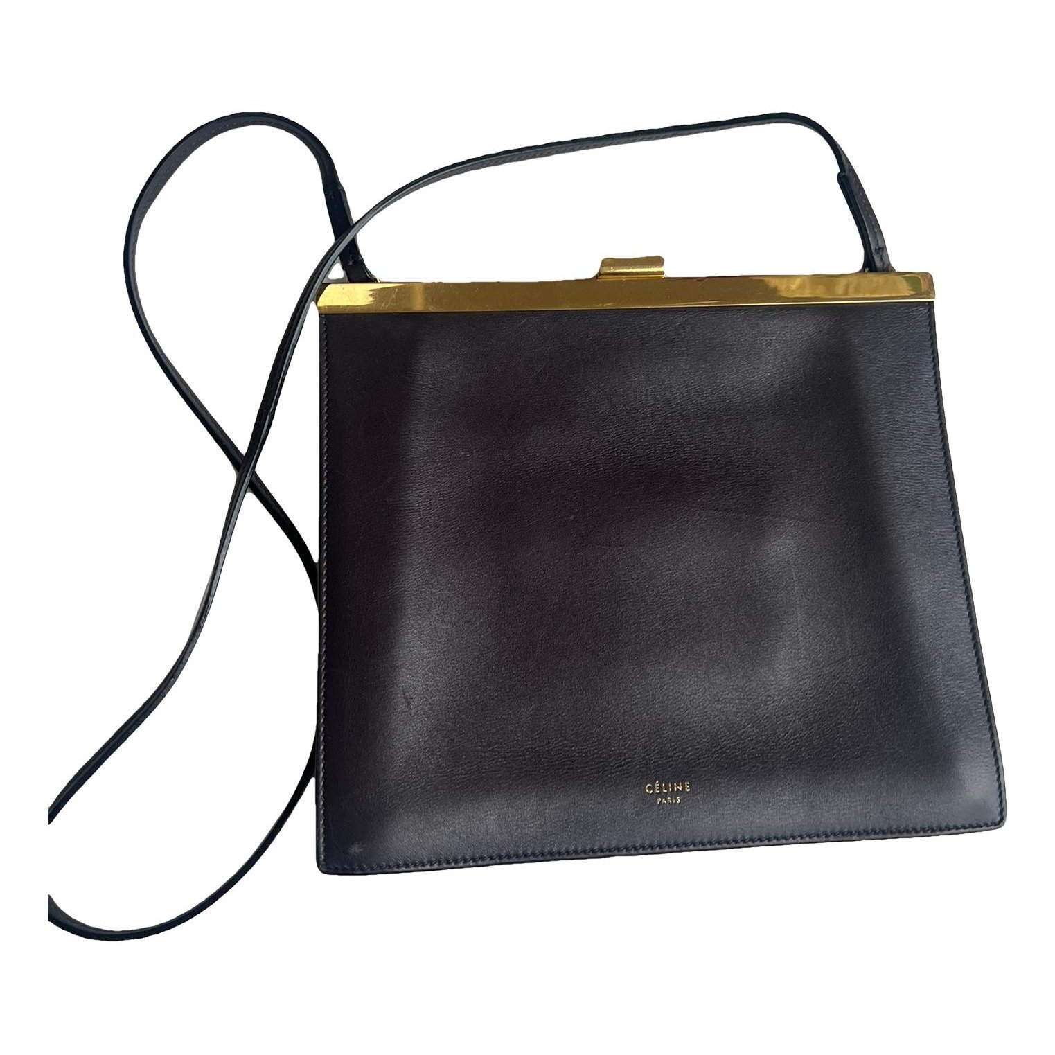 Clasp leather handbag