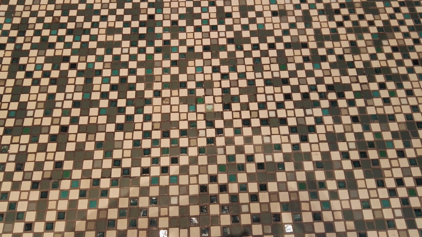 Hermès Rive Gauche store at 17 Rue de Sèvres, Paris — the Art Deco Piscine Lutetia building with mosaic facade details