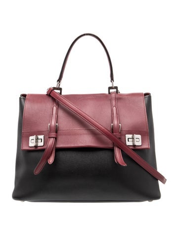 Saffiano Leather The handbag shown in the image is the elegant City Calf Double Turn-Lock Flap