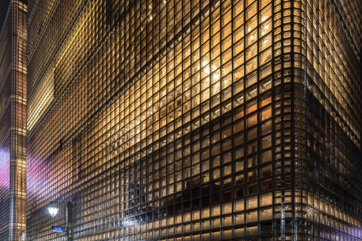 Maison Hermès Ginza — illuminated glass block facade at night