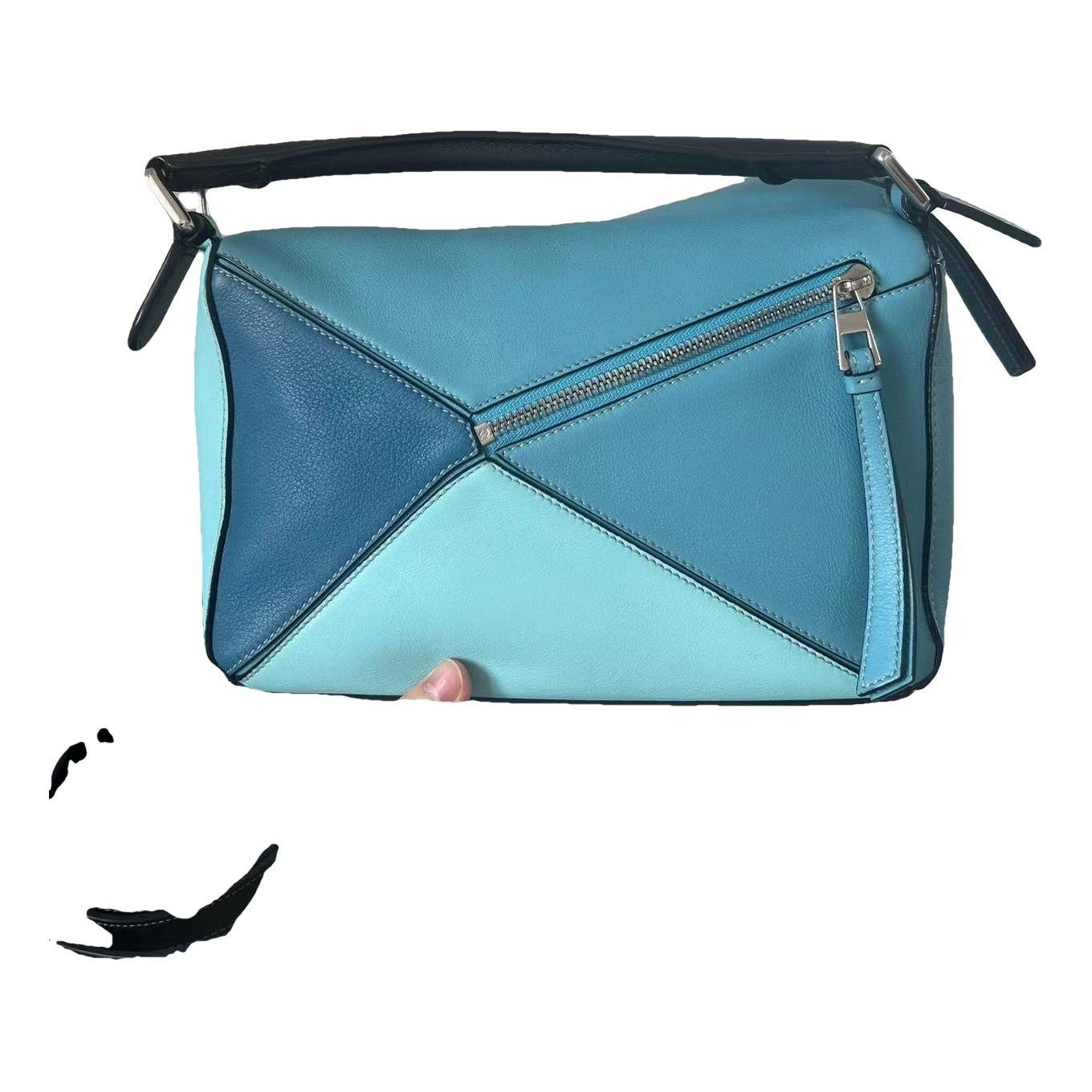 Puzzle leather handbag