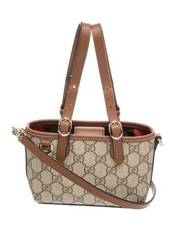 GG Canvas GG Emblem mini bag Mini