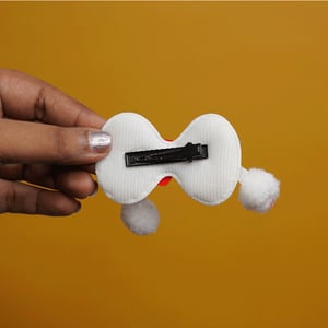 Shiny Stone Finish Bow Shape Pompom Hair Clip - White