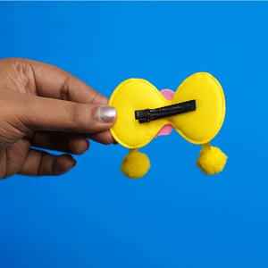 Shiny Bow Shape Pompom Hair Clip - Yellow