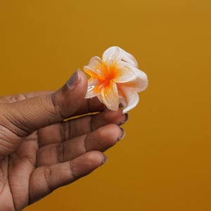 Glossy Plumeria Flower Shape Hair Clip - Orange