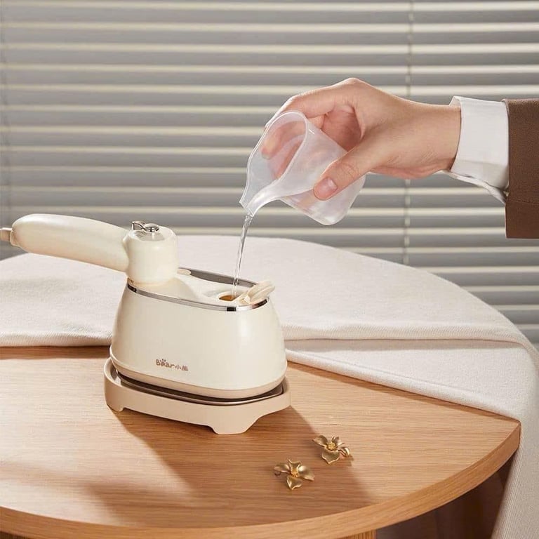 BÀN LÀ HƠI NƯỚC CẦM TAY MINI BEAR DYD-J10Q1