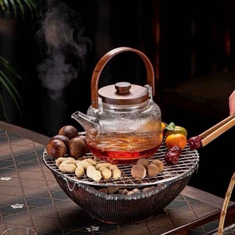 Bộ ấm trà thuỷ tinh chịu nhiệt cao , trong suốt như pha lê .