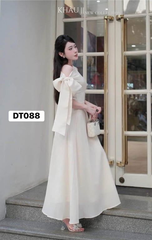 Váy kem cột chéo tay dài Khâu
