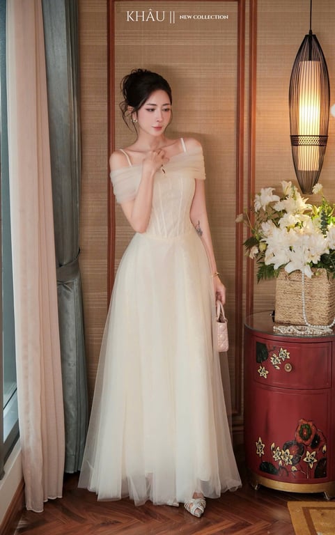 Đầm 2 dây choàng lưới kem Khâu - size M