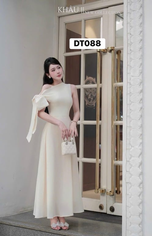 Váy kem cột chéo tay dài Khâu