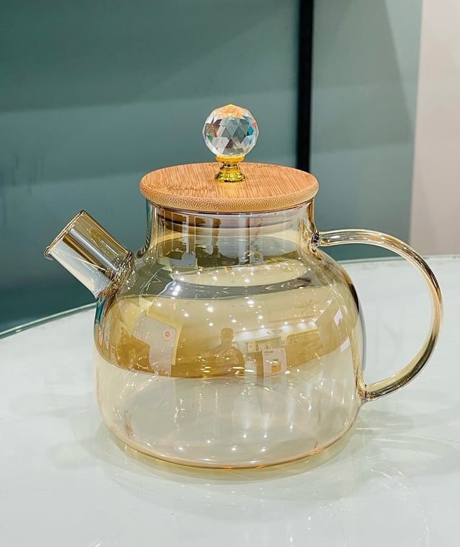 Bình này là thuỷ tinh chịu nhiệt, đun đc trên bếp.