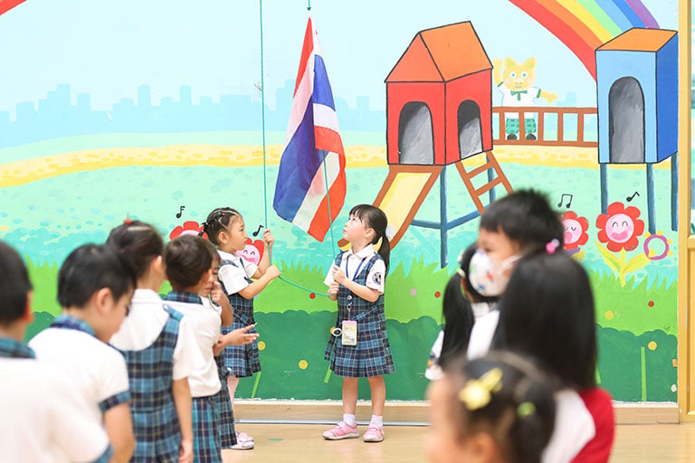 Students gathered for a Thai flag-raising activity.