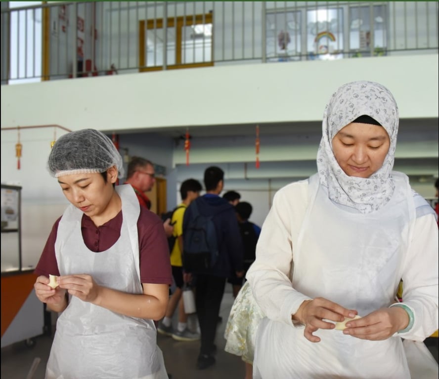 Boarding students and Parents working together at the dumpling workshop.