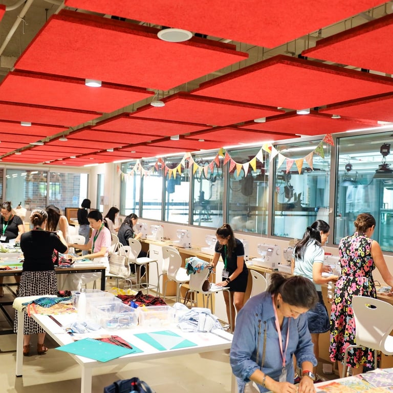 Students, staff, and parents come together to make quilts for refugees from Myanmar.