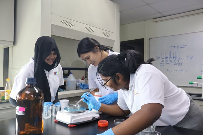 Students presenting a practical experiment during the STEM Expo event.