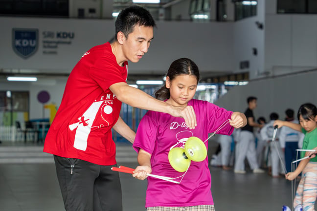Students take on their Diabolo CCA, a traditional Chinese spinning-top activity that improves their hand-eye coordination, patience, focus, and creativity.